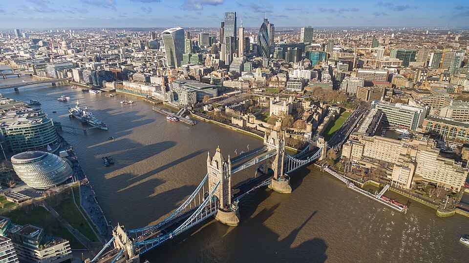 London to Caen. Image above the Thames showing Tower Bridge, Tower of London and HMS Belfast