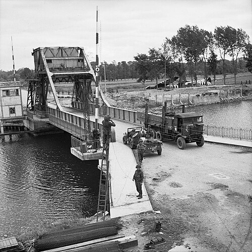 British forces at Pegasus Bridge after its capture. The Horsa Gliders can still be seen in the background. Pegasus Bridge Day Trip